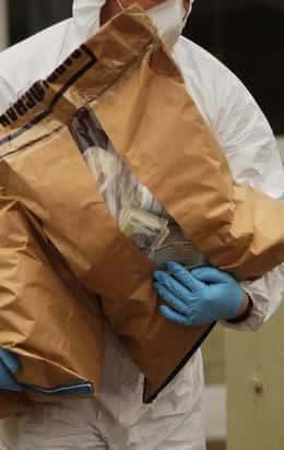 Gardaí removing bags of sterling (from the <i>Irish Independent</i>) (clicky)