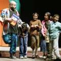 Fishy with kids in Iraq’s National Theatre (clicky)